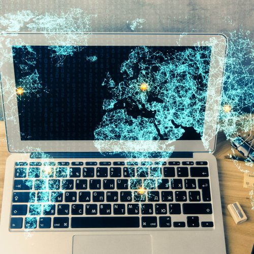 Computer on desktop with social network hologram. Multi exposure. Concept of international people connections. Computer on desktop with social network hologram. Multi exposure. Concept of international people connections.