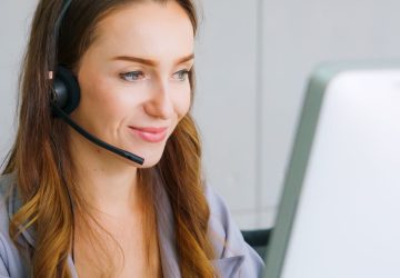 Business people wearing headset working in office Business people wearing headset working in office to support remote customer or colleague. Call center, telemarketing, customer support agent provide service on telephone video conference call.